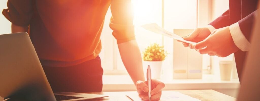 Business-people using a loan checker