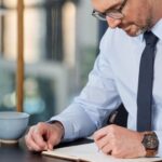 Businessman conducting an analysis of R&D tax reliefs, innovation grants, and R&D advance funding options.