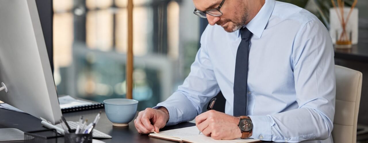 Businessman conducting an analysis of R&D tax reliefs, innovation grants, and R&D advance funding options.