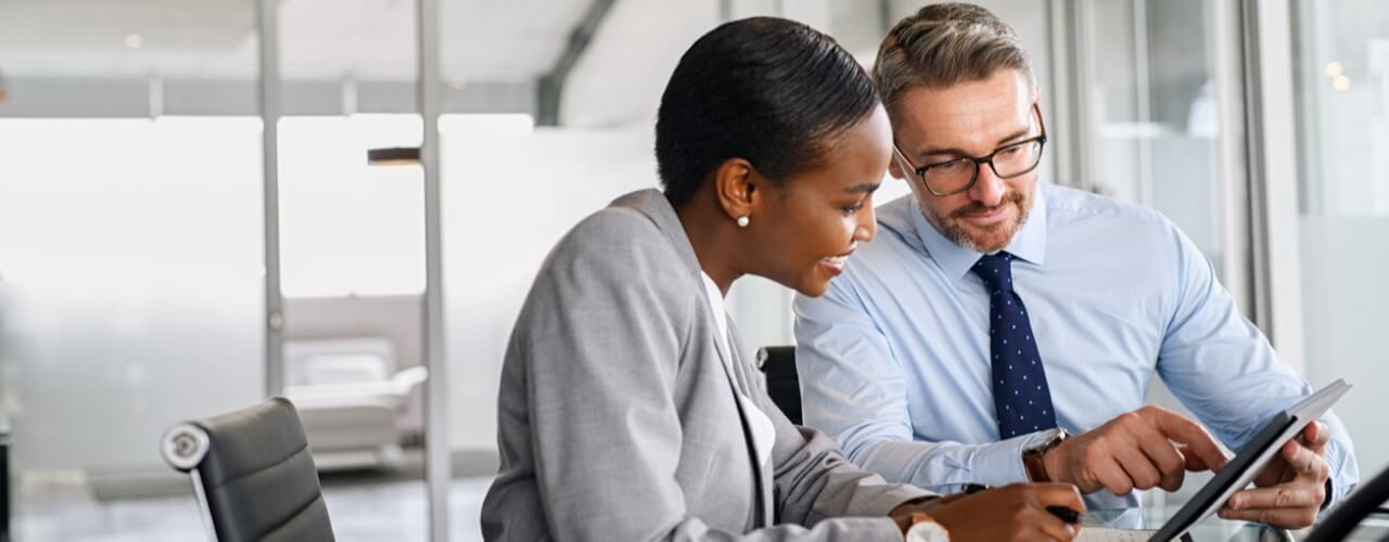 Two business people discussing the changes in the venture growth market.